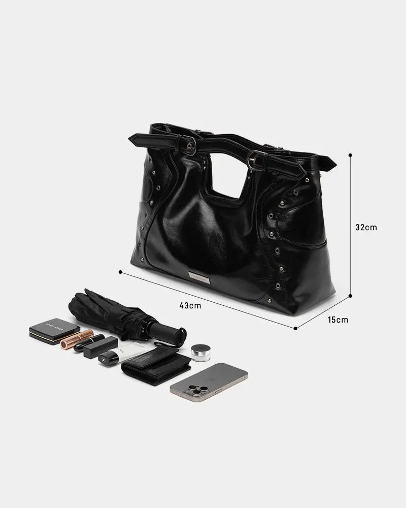 Black oily leather motorcycle-style bag