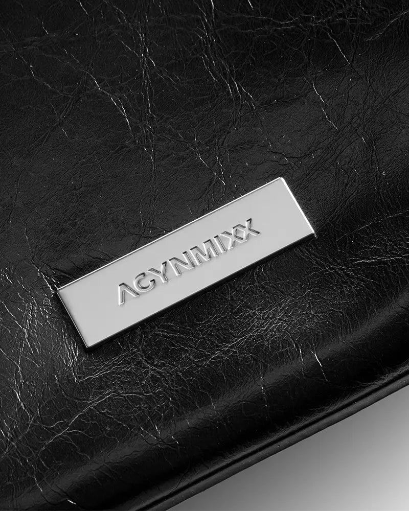 Black oily leather motorcycle-style bag